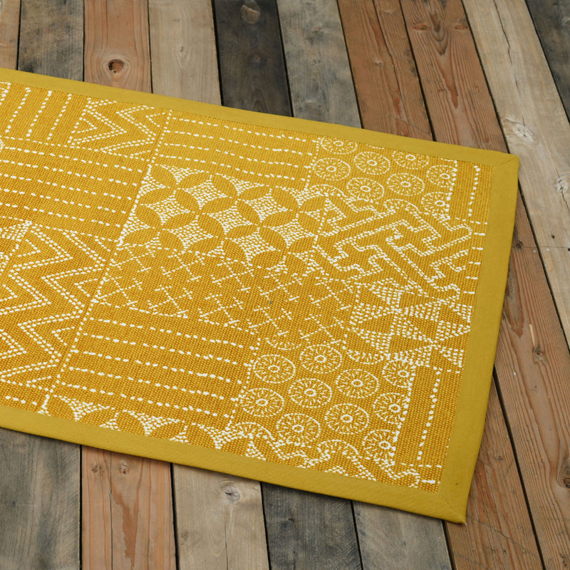 Cotton printed rug in mustard colour with geometric print