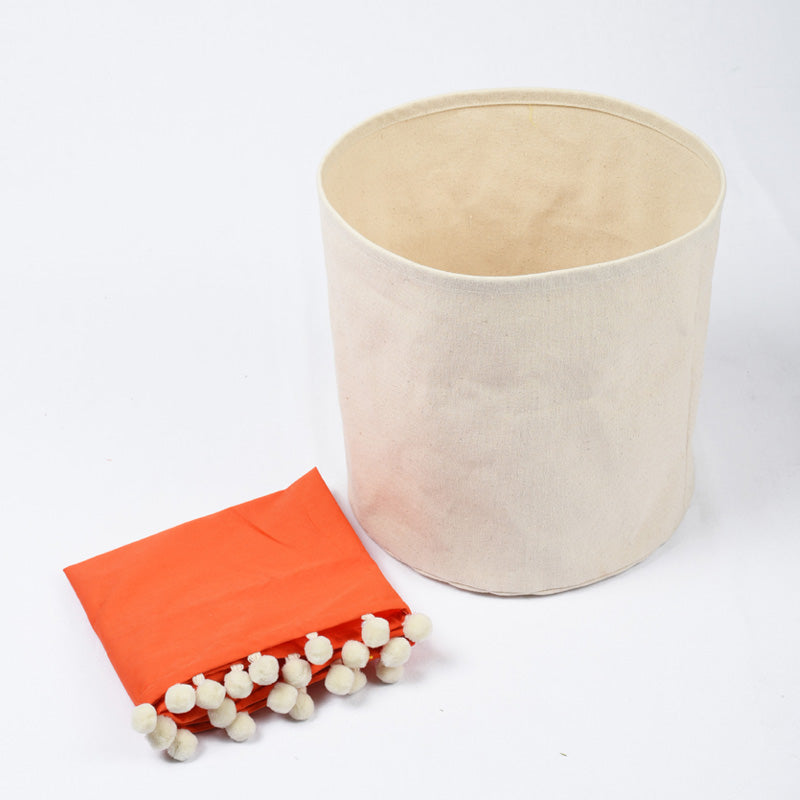 Canvas storage basket with orange cotton lining and pompoms, sizes available