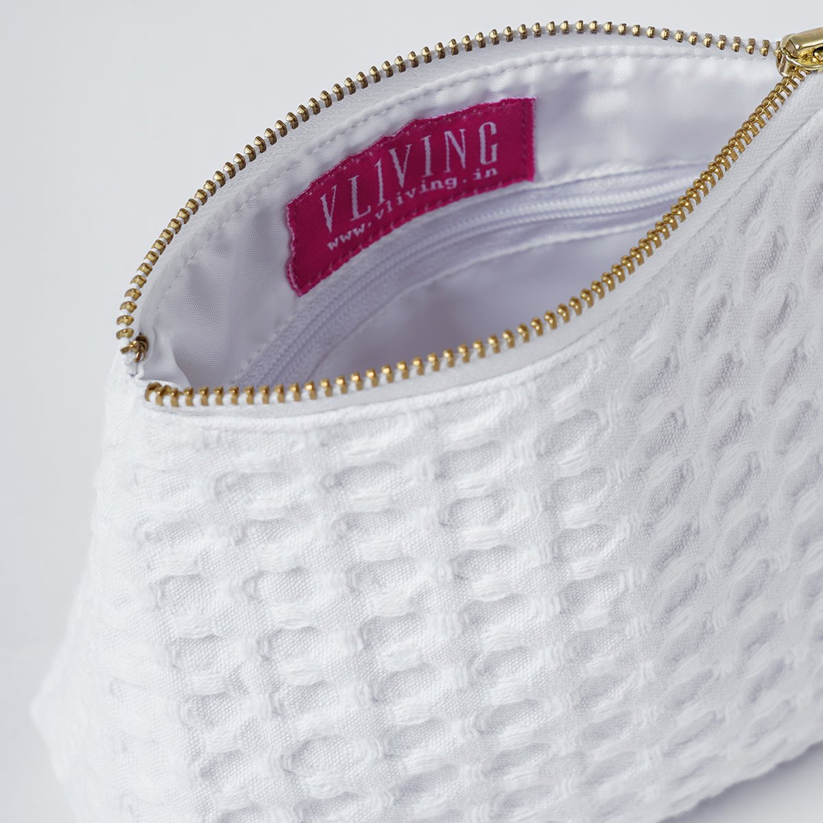 A pair of White Waffle Nesting pouches