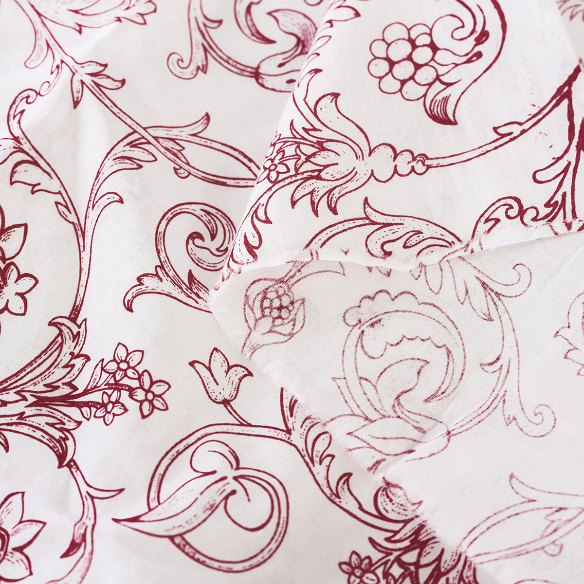 Red printed sheer fabric, Victorian swirl pattern
