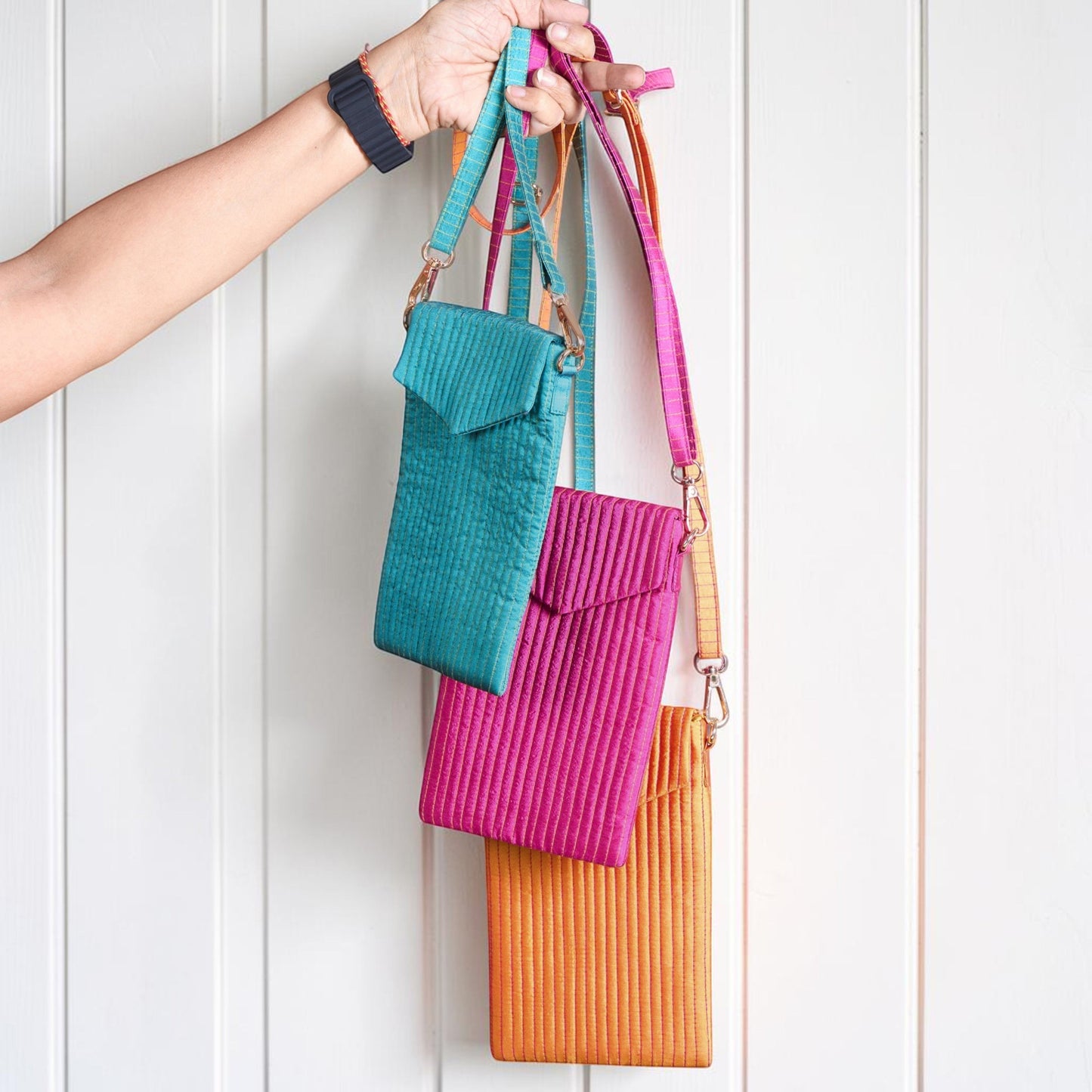 Vliving tangerine quilted crossbody phone bag with strap, faux silk fabric, magnetic closure, zippered pocket.