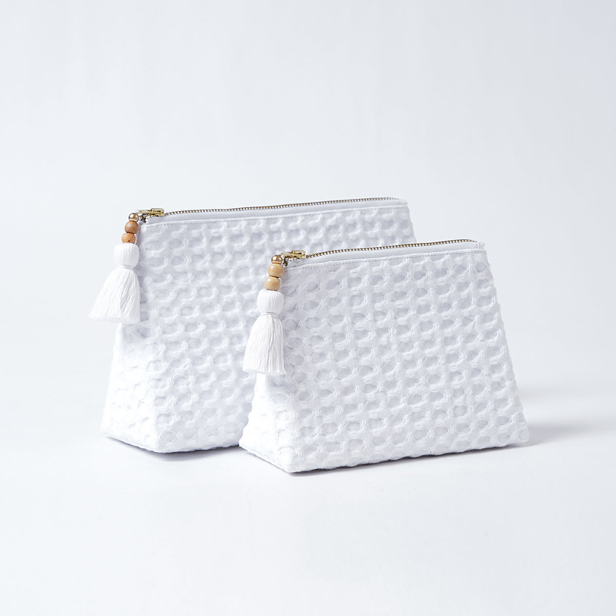 A pair of White Waffle Nesting pouches