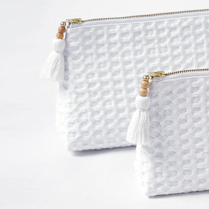 A pair of White Waffle Nesting pouches