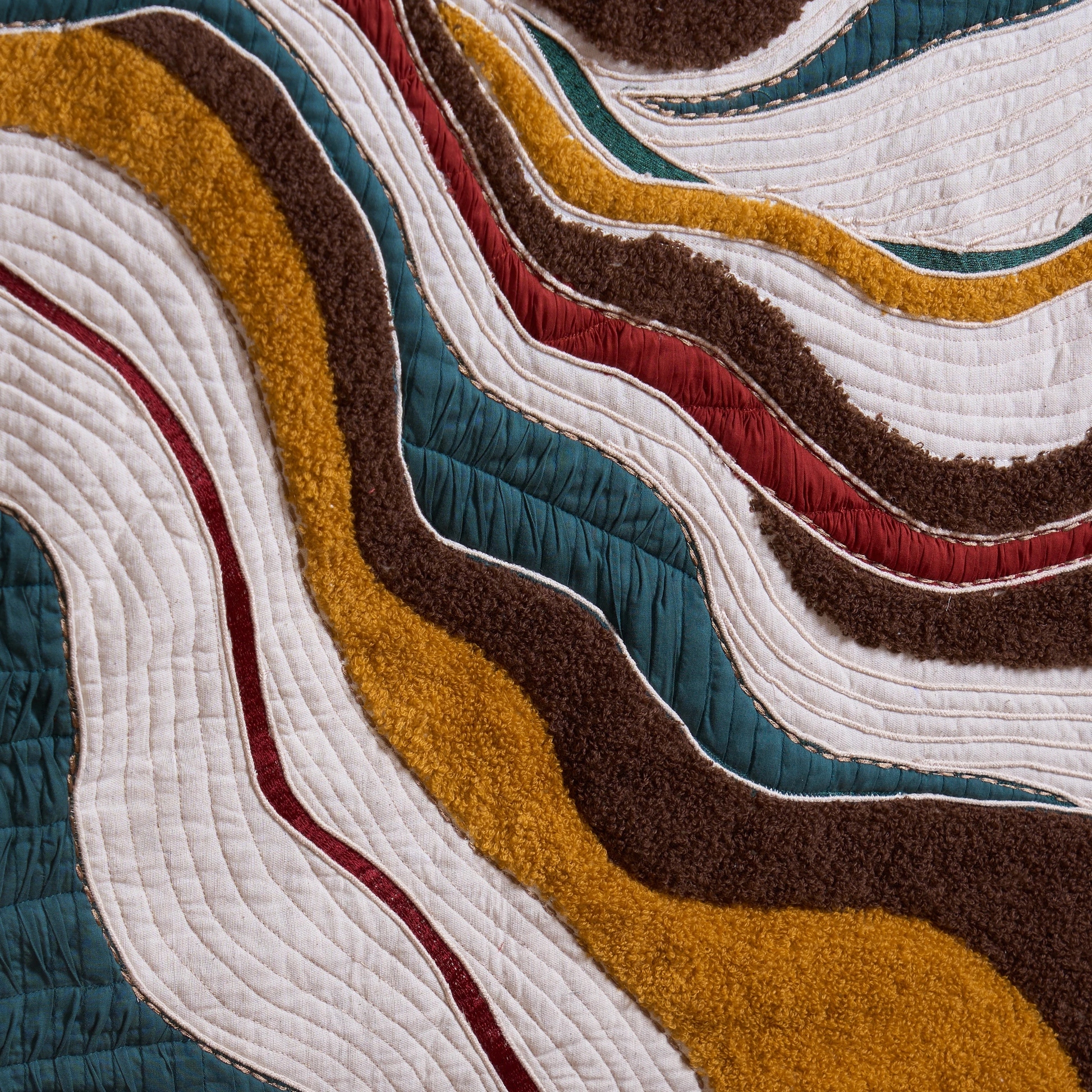 Vliving abstract textile wall art with wavy bands of teal, red, mustard gold, brown, and ivory. Mixed media with bouclé and embroidery.