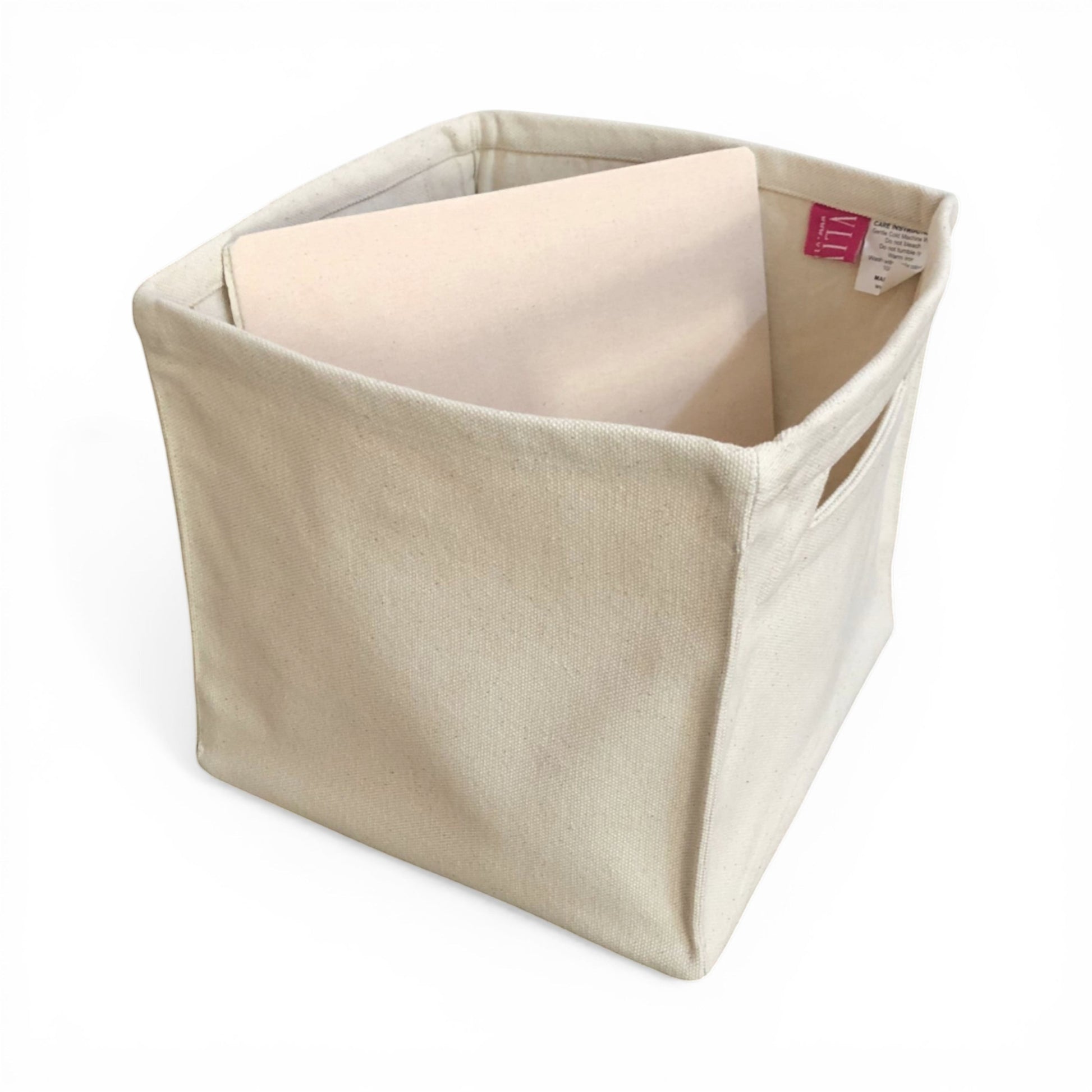 Vliving natural canvas storage basket with cut-out handles and reinforced base. Square shape, neutral tone.