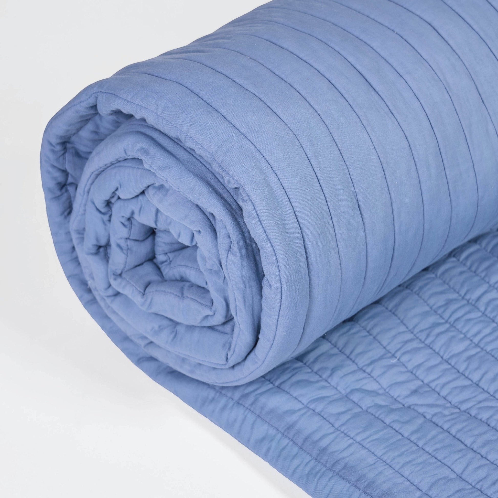 Vliving denim blue cotton voile quilted bed blanket with stripe pattern and border. Soft and cozy for all seasons.