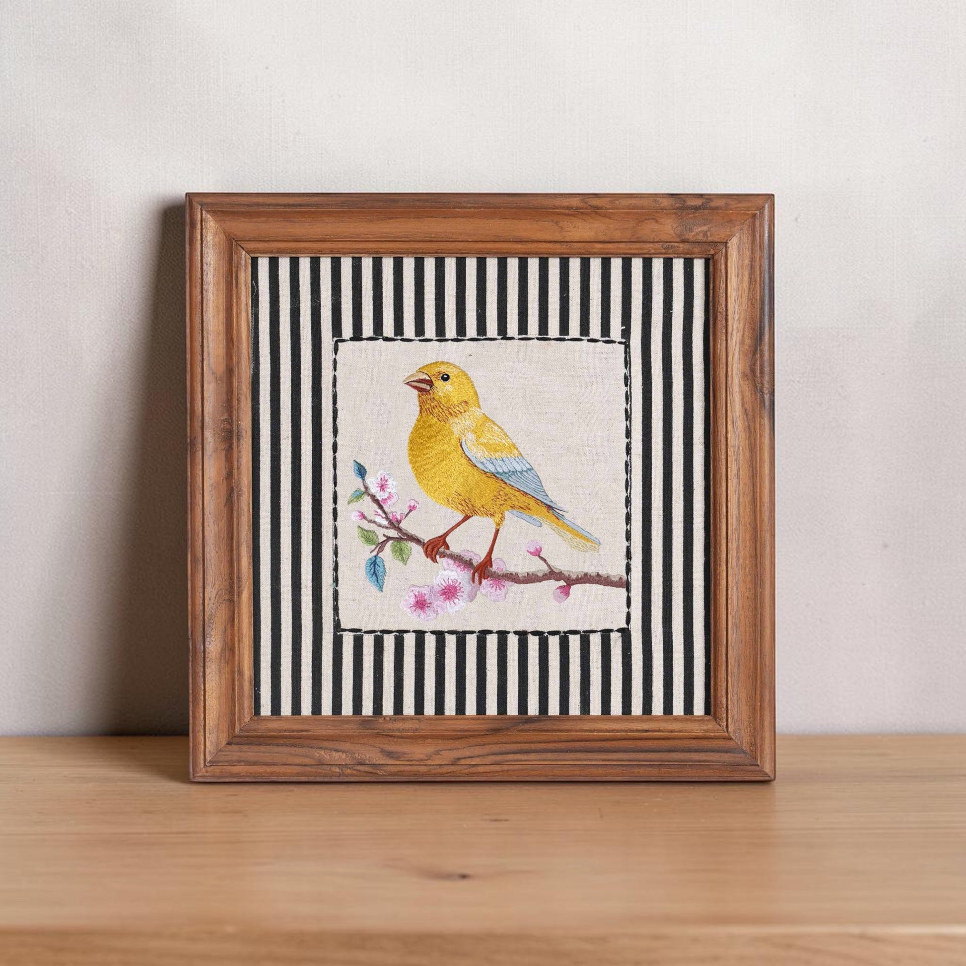 Vliving framed embroidered canary yellow bird wall art on linen fabric with cherry blossoms and black and white stripes.