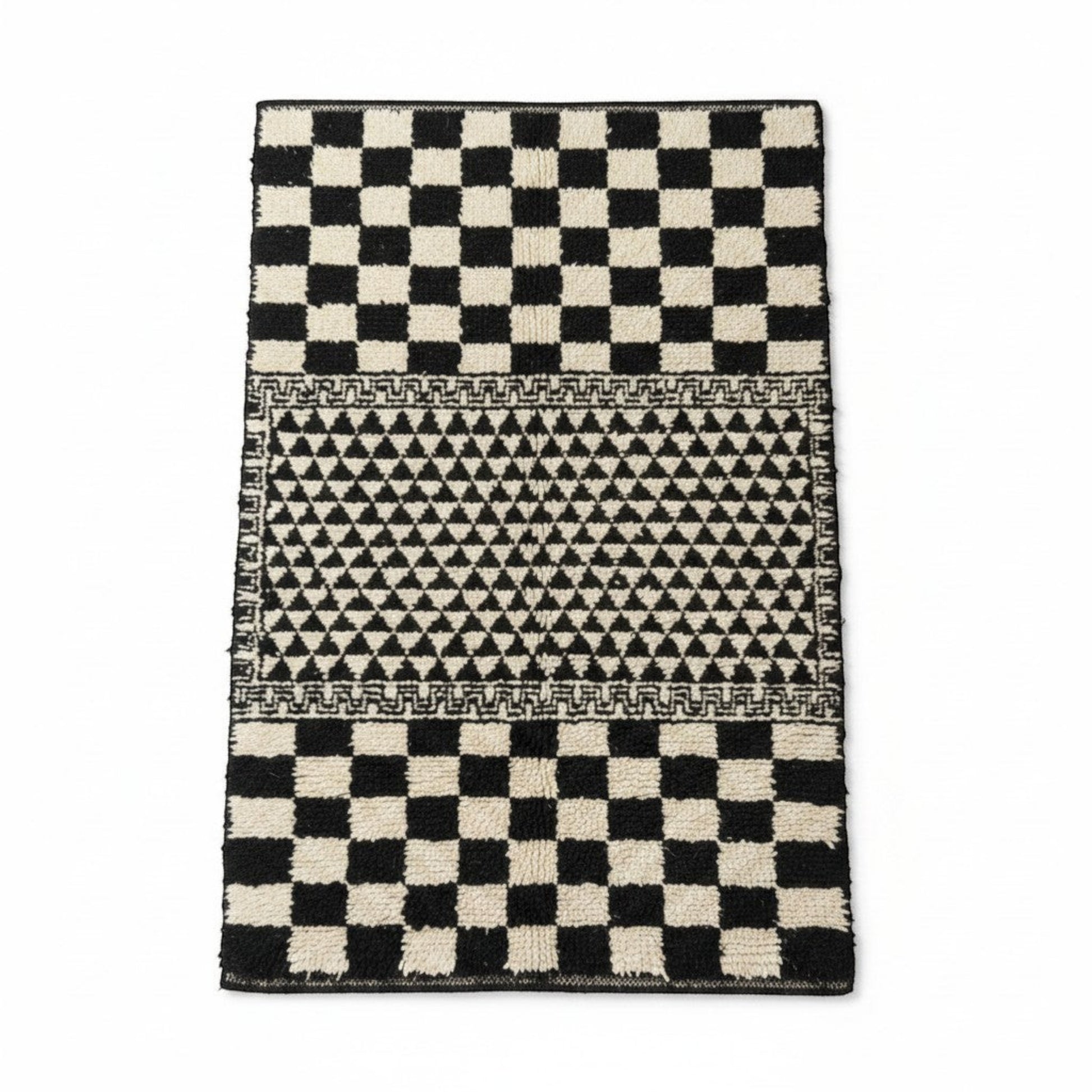 Vliving black and white hand-knotted Moroccan wool blend carpet with geometric patterns and checkerboard ends.