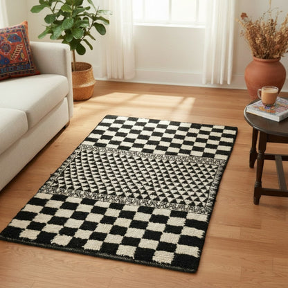 Vliving Moroccan hand-knotted wool blend carpet in black and white with geometric patterns and checkerboard design.