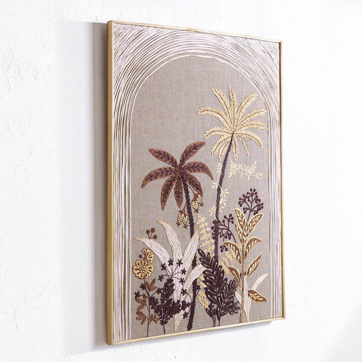Vliving textured tropical botanical wall art in raffia and linen, featuring palm trees and lush foliage in warm neutral tones.