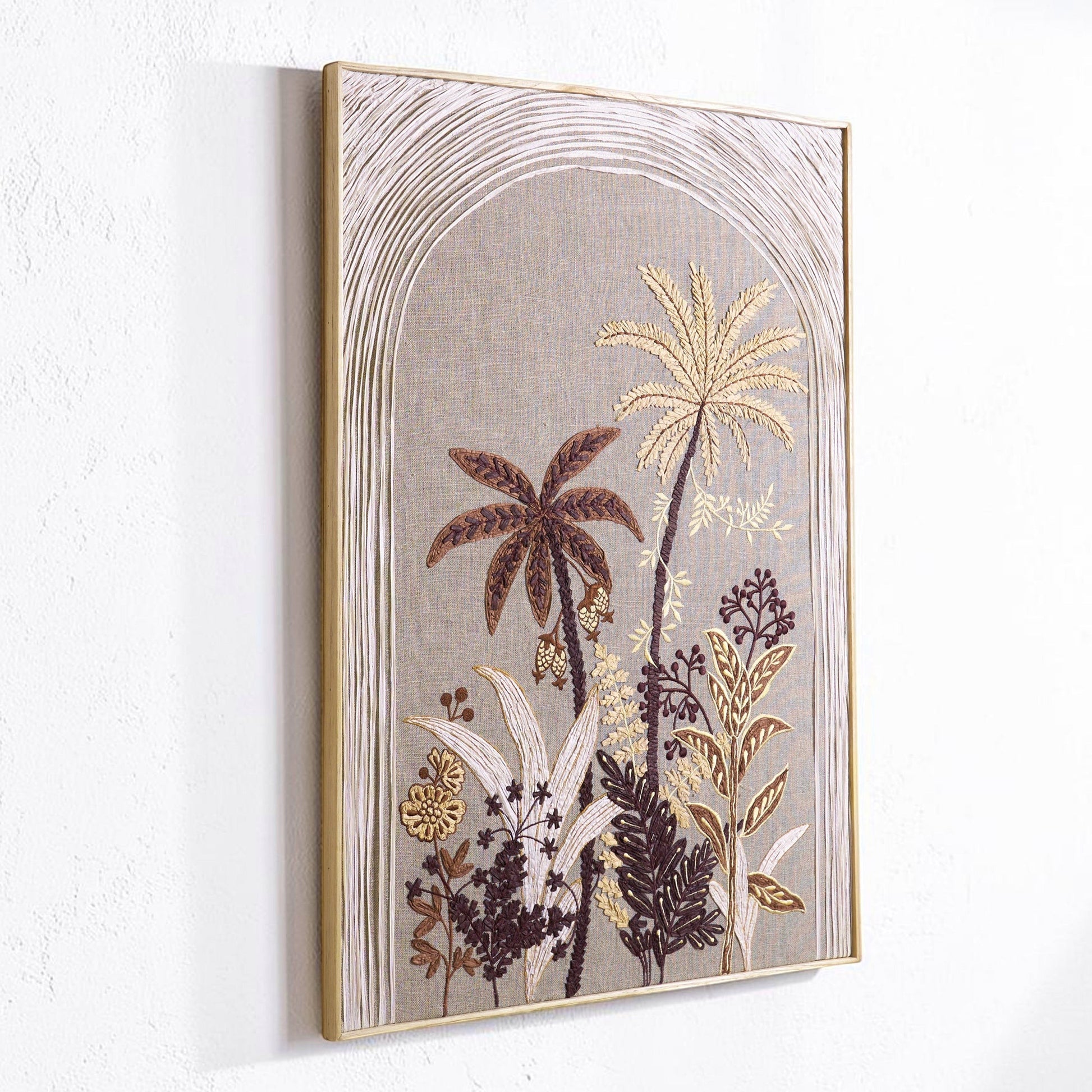 Vliving textured tropical botanical wall art in raffia and linen, featuring palm trees and lush foliage in warm neutral tones.